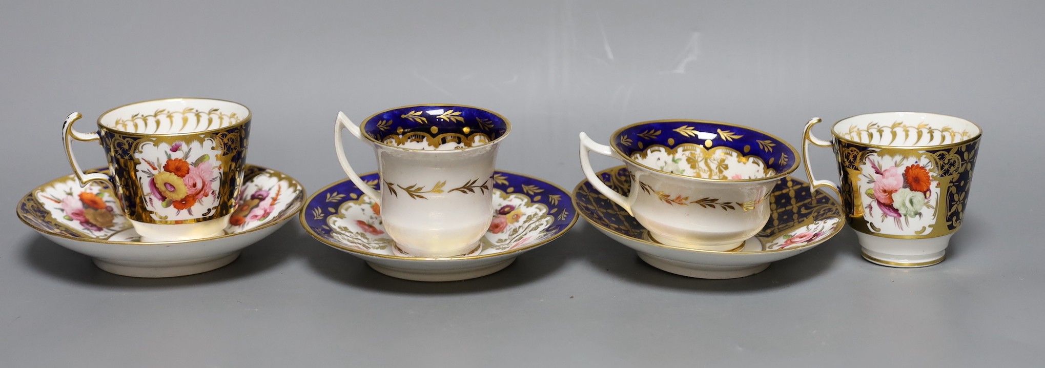 An early 19th century pair of Coalport coffee cups and saucer painted with pattern 793 and a New Hall Coffee cup, teacup and saucer, See M. Messanger, Coalport, page 168, plate 114 for pattern 793, New hall cup 6.5 cms h
